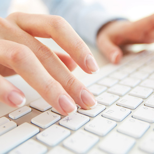 woman typing on a keyboard