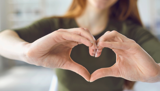 Woman framing a heart with her hands